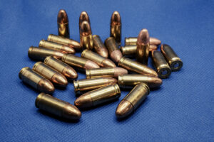 image of 9mm bullets on a blue background
